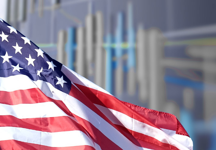 Welle der US-Flagge vor einem verschwommenen Chart, vermittelt wirtschaftliche Dynamik.