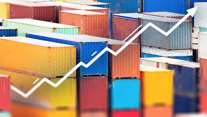 Bunte Container gestapelt, mit einem steigenden Diagramm, symbolisiert die wachsenden Zölle