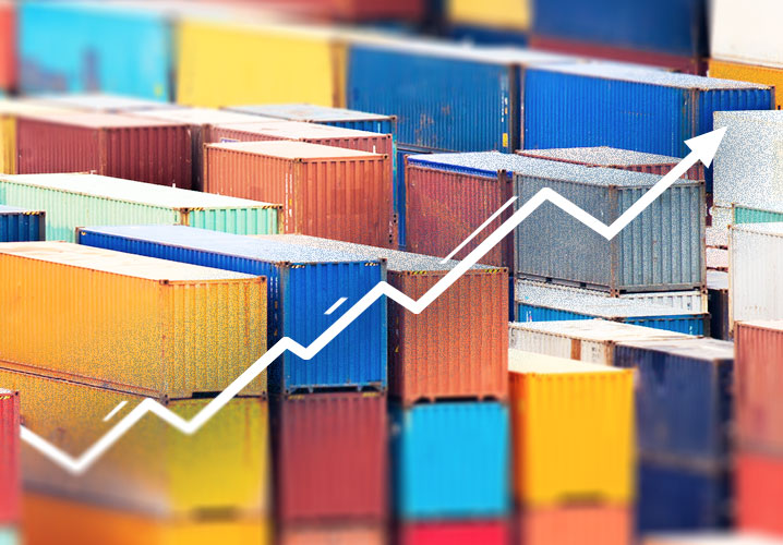 Bunte Container stapeln sich, symbolisieren wirtschaftliche Dynamik.